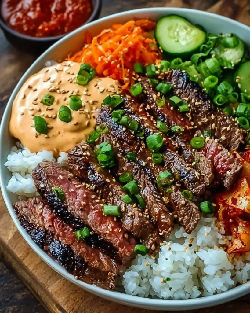 Delicious Korean BBQ steak rice bowl with spicy cream sauce